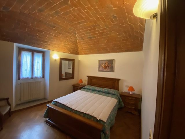 Camera con soffitto a volta in mattoni, appartamento Lo Sdrucciolo